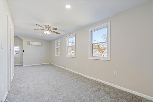 spare room with lofted ceiling, a wall mounted air conditioner, light colored carpet, and ceiling fan