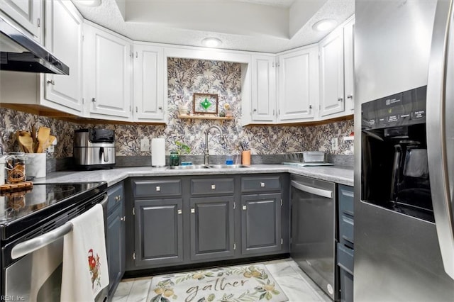 kitchen with gray cabinets, white cabinetry, appliances with stainless steel finishes, and sink