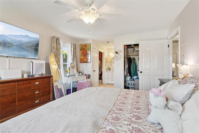 bedroom with ceiling fan and a closet