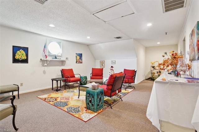 interior space featuring light carpet and a textured ceiling