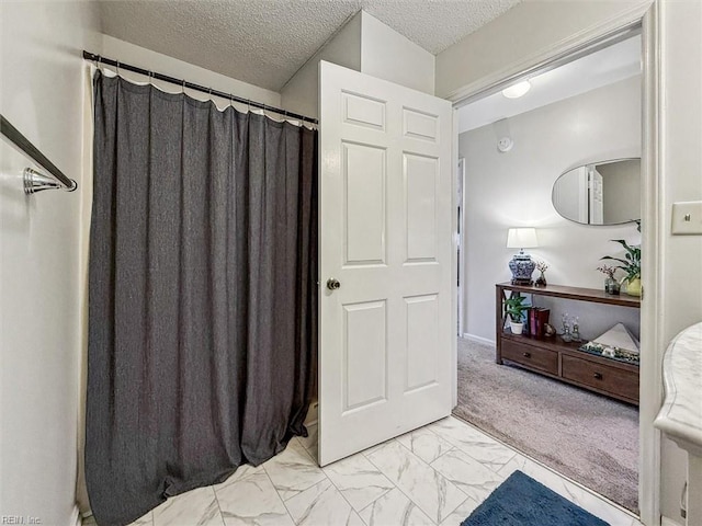 bathroom featuring a textured ceiling