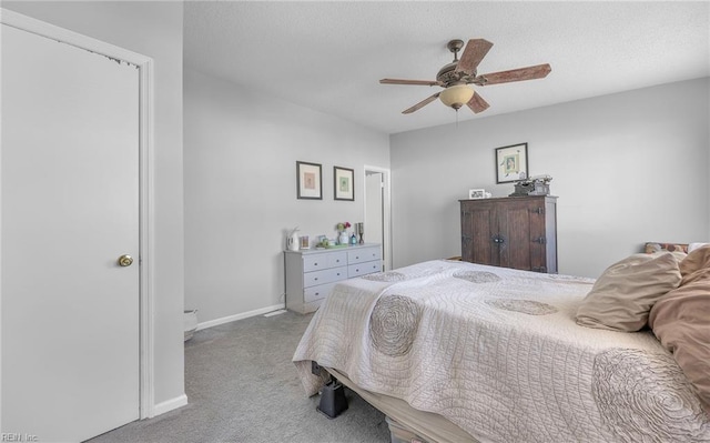 bedroom featuring light colored carpet and ceiling fan