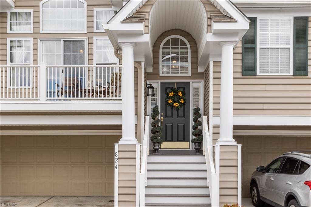 view of exterior entry featuring a garage