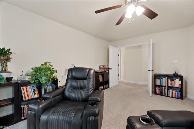 sitting room with light carpet and ceiling fan