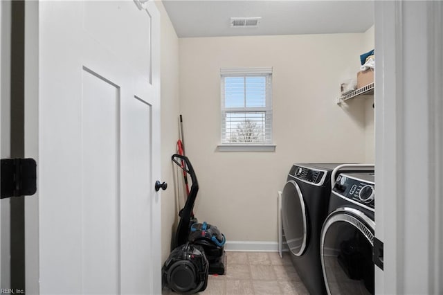 laundry area featuring washer and clothes dryer