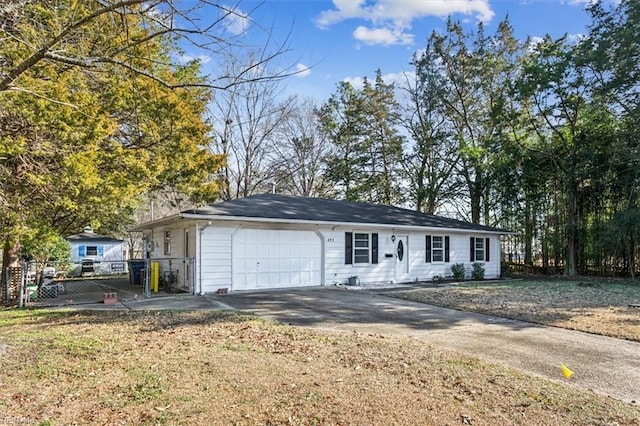 view of front of property featuring a garage and a front yard