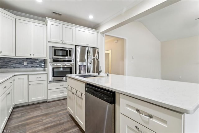 kitchen with white cabinetry, appliances with stainless steel finishes, dark wood-type flooring, and sink