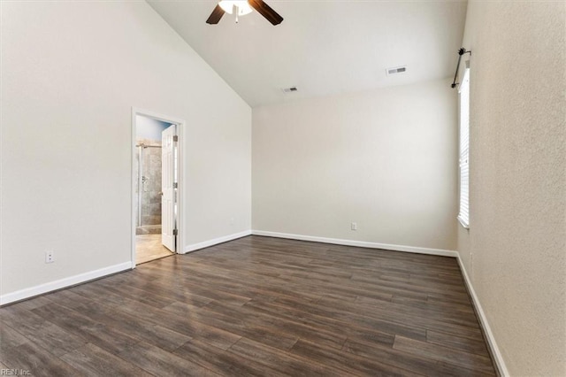 spare room with high vaulted ceiling, dark hardwood / wood-style floors, and ceiling fan