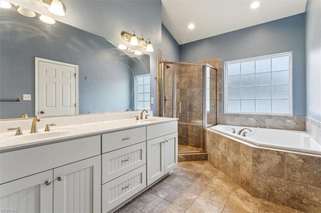 bathroom featuring tile patterned flooring, vanity, and separate shower and tub