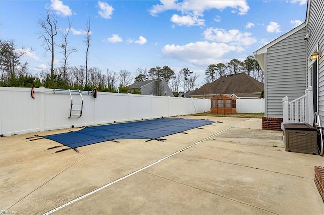 view of swimming pool with a gazebo and a patio area