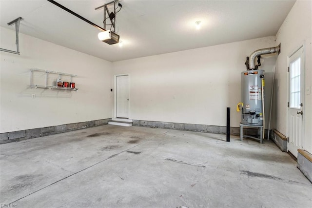 garage with water heater and a garage door opener