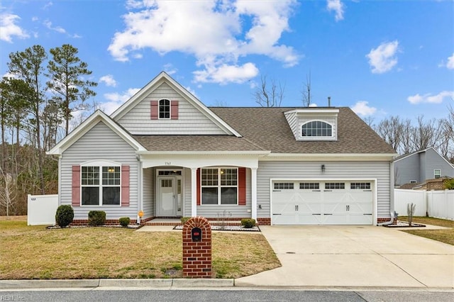 view of front facade with a garage and a front lawn