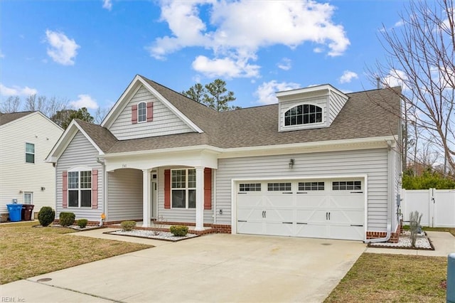 view of front of house with a garage and a front yard