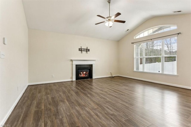 unfurnished living room with vaulted ceiling, ceiling fan, and dark hardwood / wood-style flooring