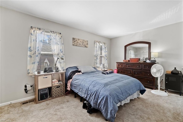 bedroom featuring light colored carpet