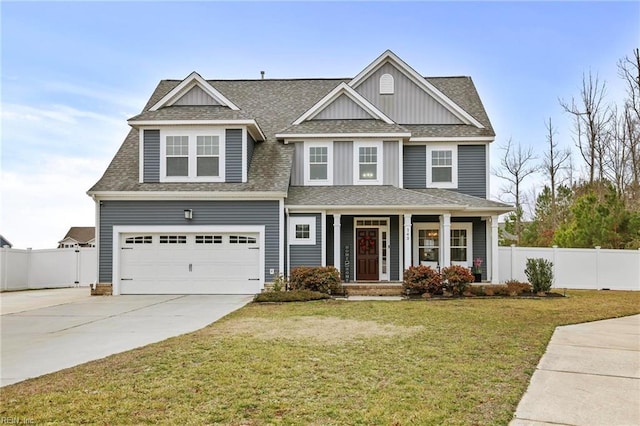 craftsman-style home with a garage and a front lawn