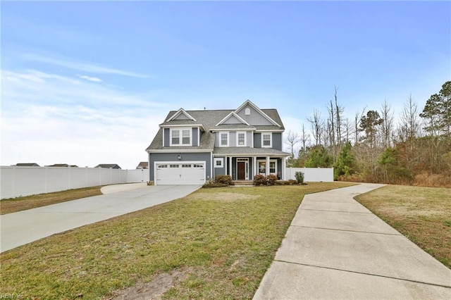 view of front of home featuring a garage and a front lawn