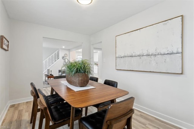 dining area with light hardwood / wood-style floors