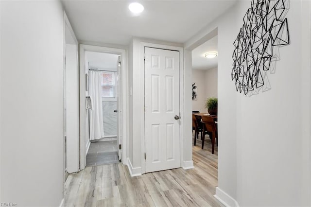 hall with light hardwood / wood-style flooring