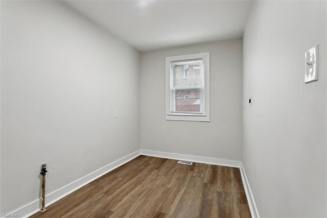 unfurnished room featuring wood-type flooring