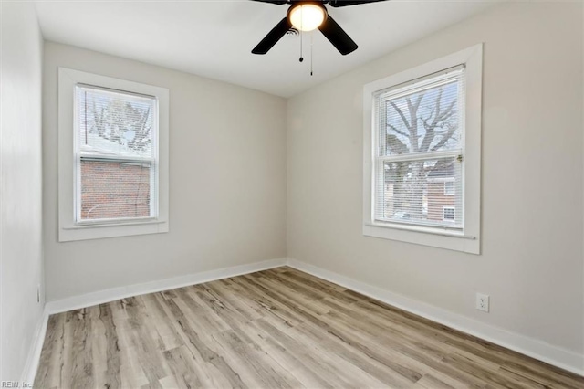 empty room with light hardwood / wood-style floors and ceiling fan