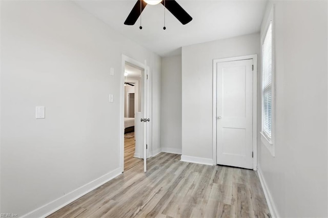 unfurnished bedroom featuring ceiling fan and light hardwood / wood-style flooring