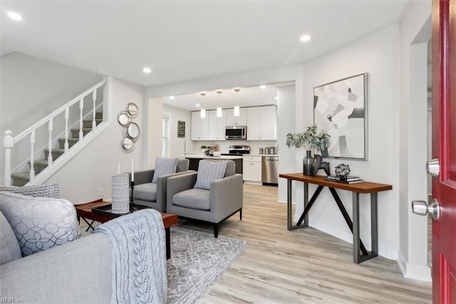 living room with light hardwood / wood-style floors