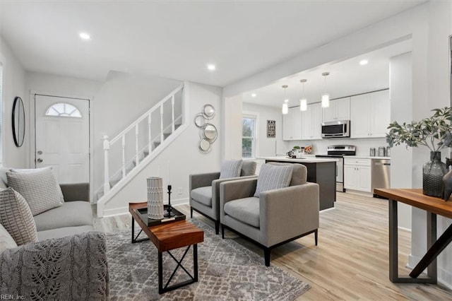 living room with light hardwood / wood-style flooring