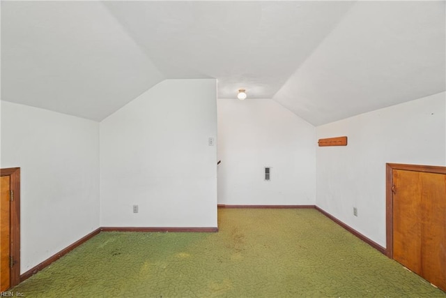 bonus room featuring lofted ceiling and carpet floors