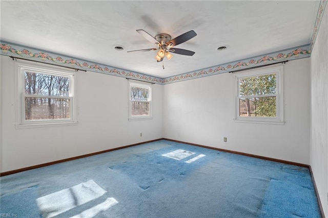 empty room with carpet floors and ceiling fan