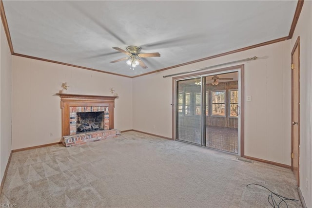 unfurnished living room with crown molding, ceiling fan, a fireplace, and light carpet