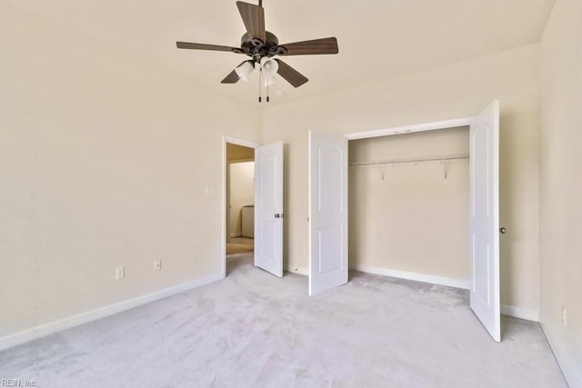 unfurnished bedroom featuring light colored carpet, ceiling fan, and a closet