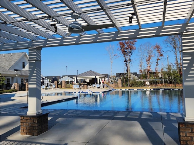 view of pool featuring a patio, a gazebo, and a pergola