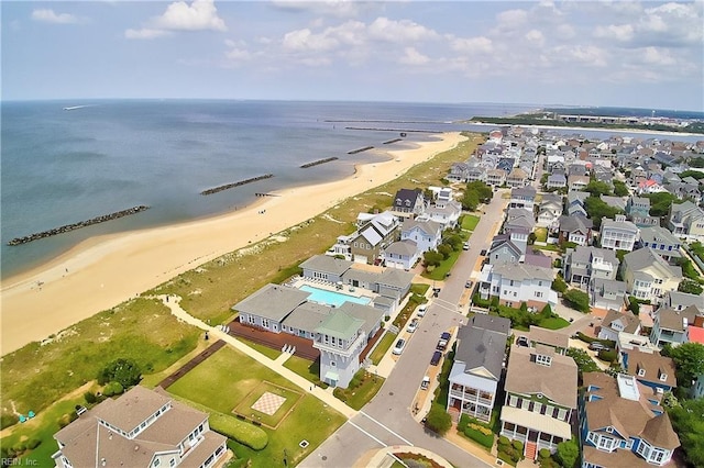 birds eye view of property with a view of the beach and a water view