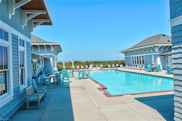 view of swimming pool with a patio