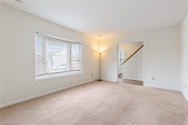 unfurnished room with carpet