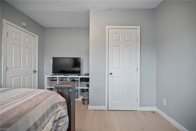 bedroom with light wood-type flooring