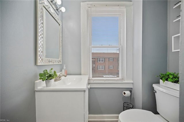 bathroom with vanity and toilet