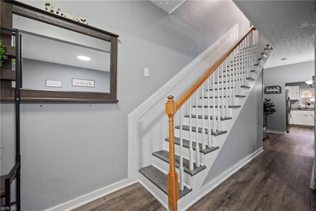 stairway featuring hardwood / wood-style floors