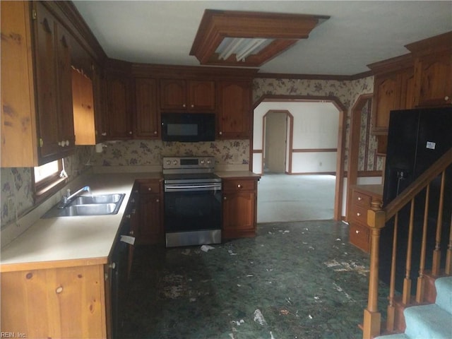 kitchen with ornamental molding, stainless steel electric stove, and sink