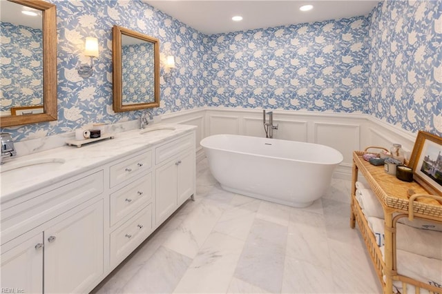 bathroom featuring vanity and a bathtub