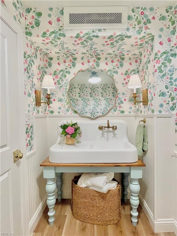 bathroom with hardwood / wood-style floors