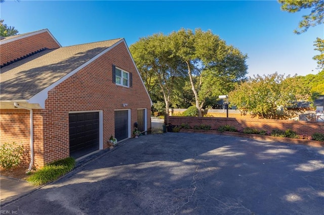 view of property exterior featuring a garage