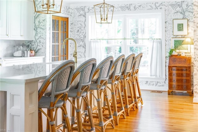 dining room featuring an inviting chandelier and light hardwood / wood-style floors