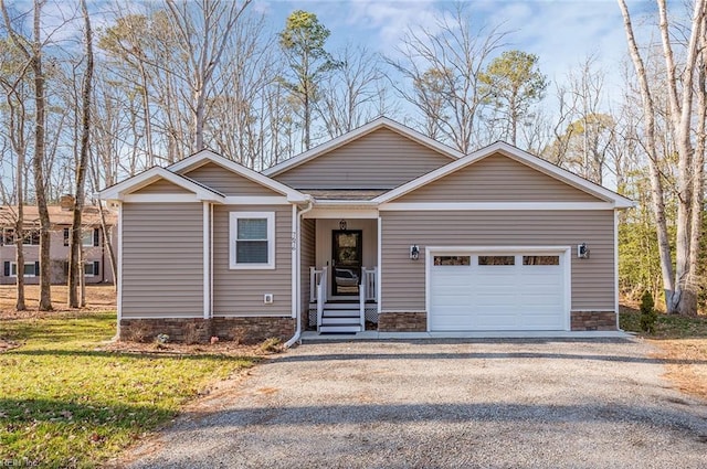 view of front of house with a garage and a front yard