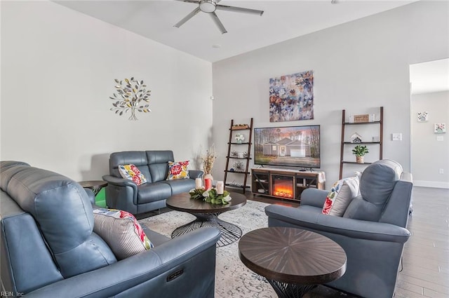 living room with hardwood / wood-style floors and ceiling fan