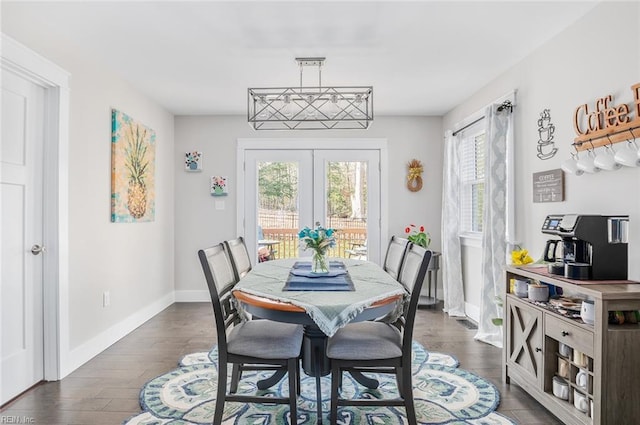 dining space featuring french doors and dark hardwood / wood-style floors