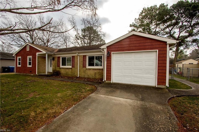 ranch-style house featuring a garage and a front lawn