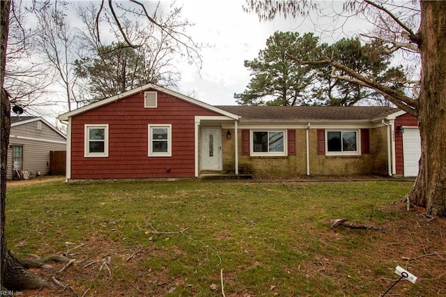 single story home featuring a front lawn