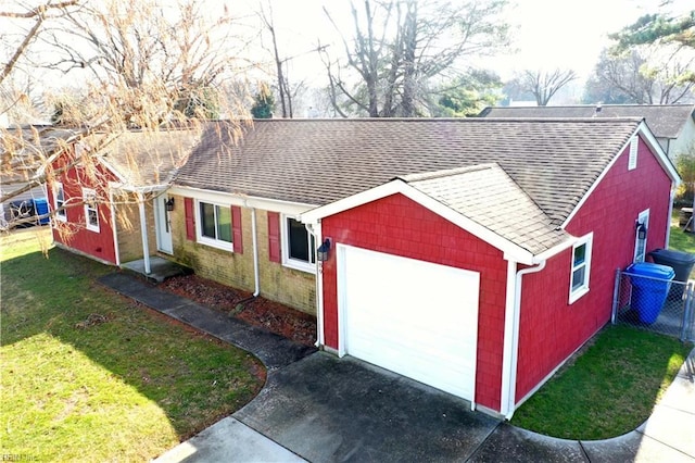 view of outbuilding with a garage and a lawn